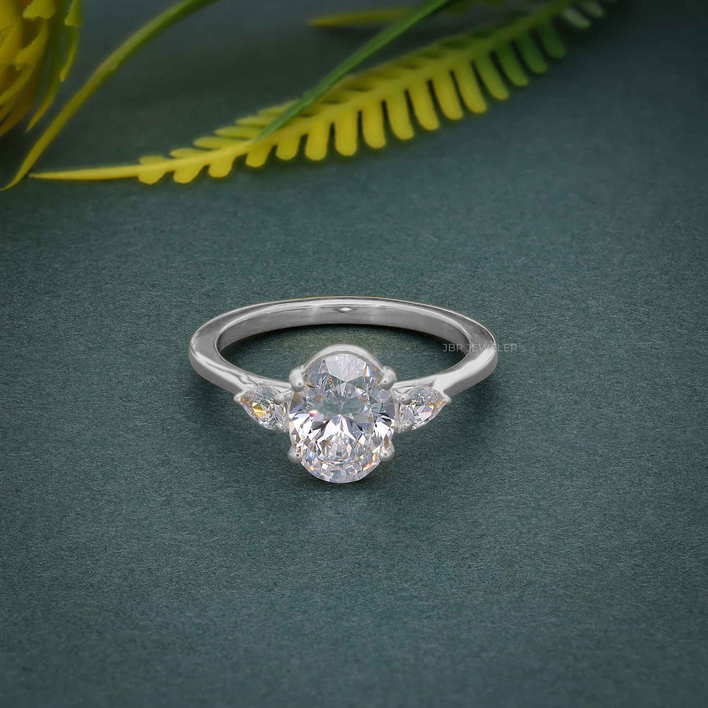 Three Stone Oval Lab Gown Diamond Ring With Side Stone Pear
